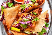 Crispy Chicken Wonton Tacos with Tangy Asian Slaw