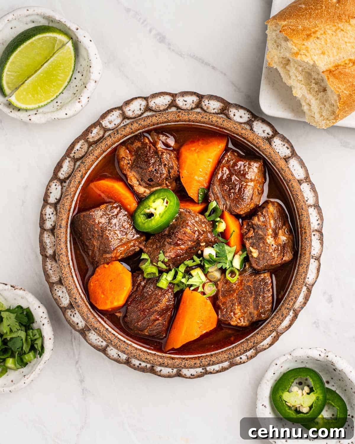 Vietnamese Beef Stew Bo Kho Recipe 12 bowl of bo kho with garnishes and bread surrounding it.
