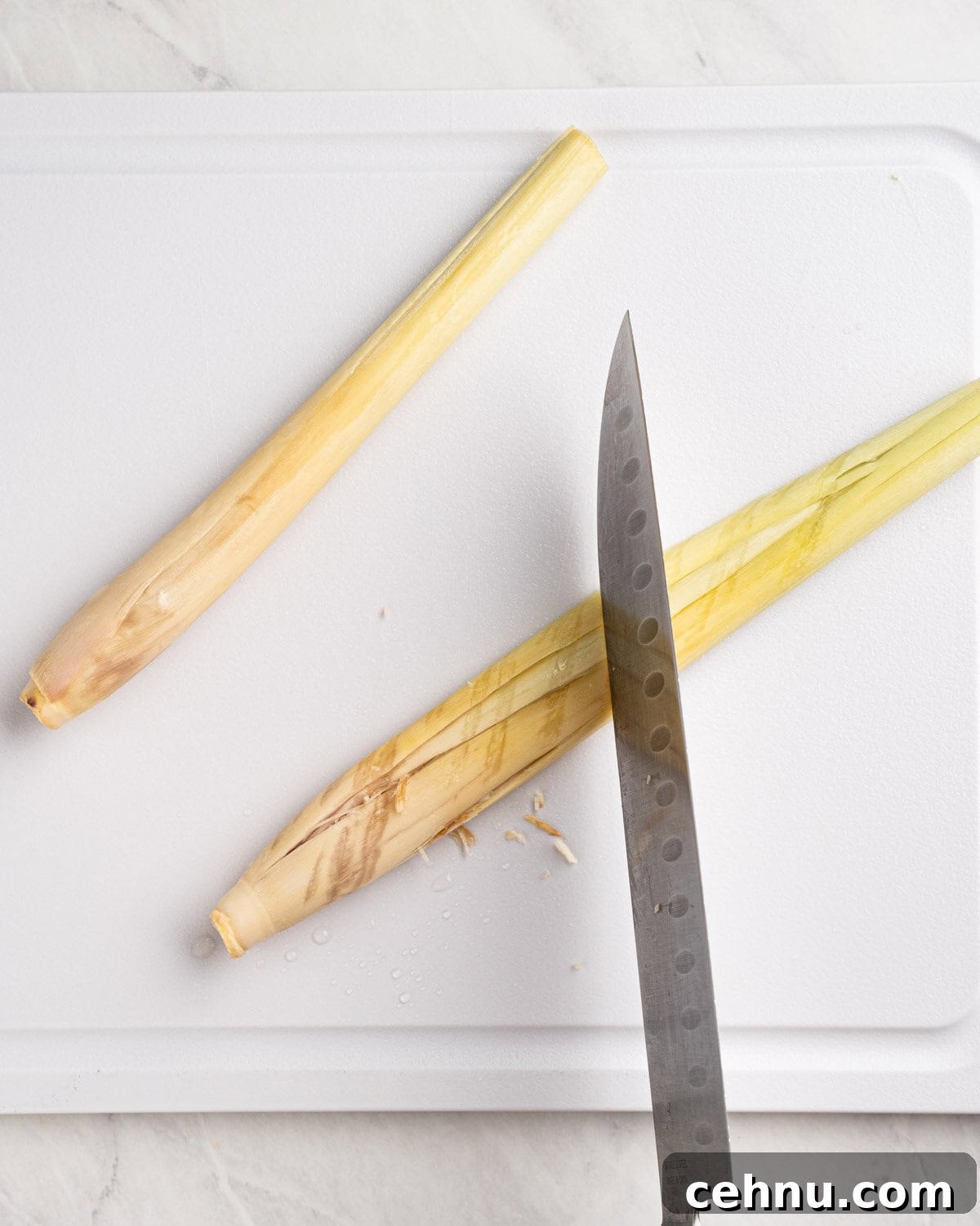 Vietnamese Beef Stew Bo Kho Recipe 6 using back of knife to bruise lemongrass.