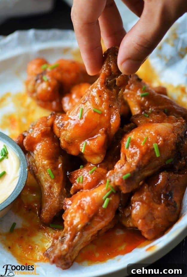 Crispy Spicy Garlic Wings Recipe 10 Copycat Chicken wings spicy garlic on a white plate