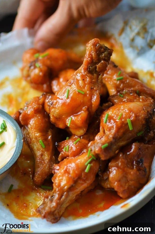 Crispy Spicy Garlic Wings Recipe 4 Copycat spicy garlic chicken wings garnished with chives