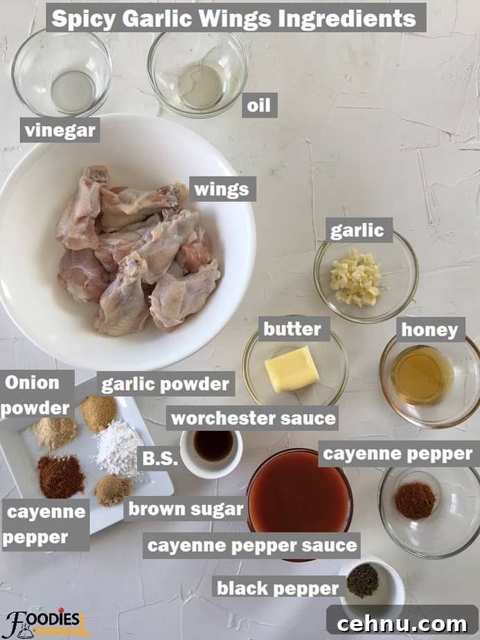 Crispy Spicy Garlic Wings Recipe 5 Recipe ingredients in bowls on a white board