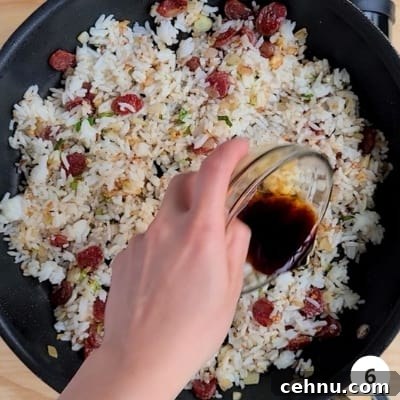 Soy sauce added into fried rice