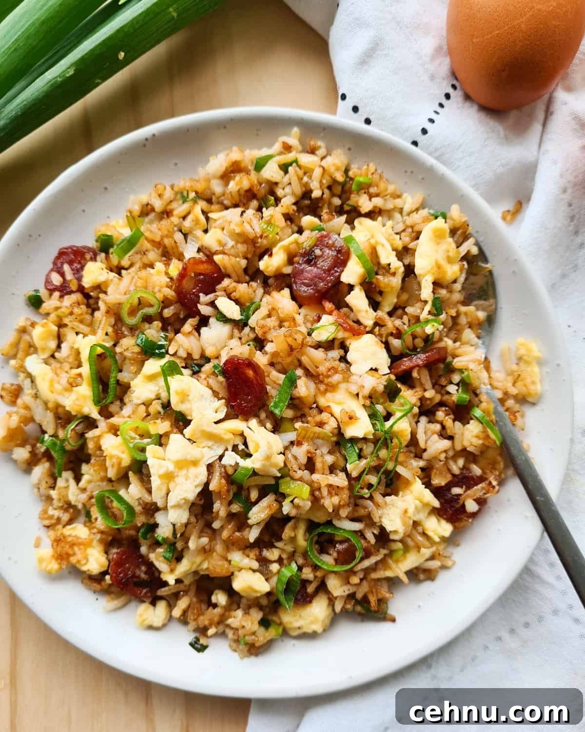 Overhead shot of a plate of fried rice with a spoon on the plate.