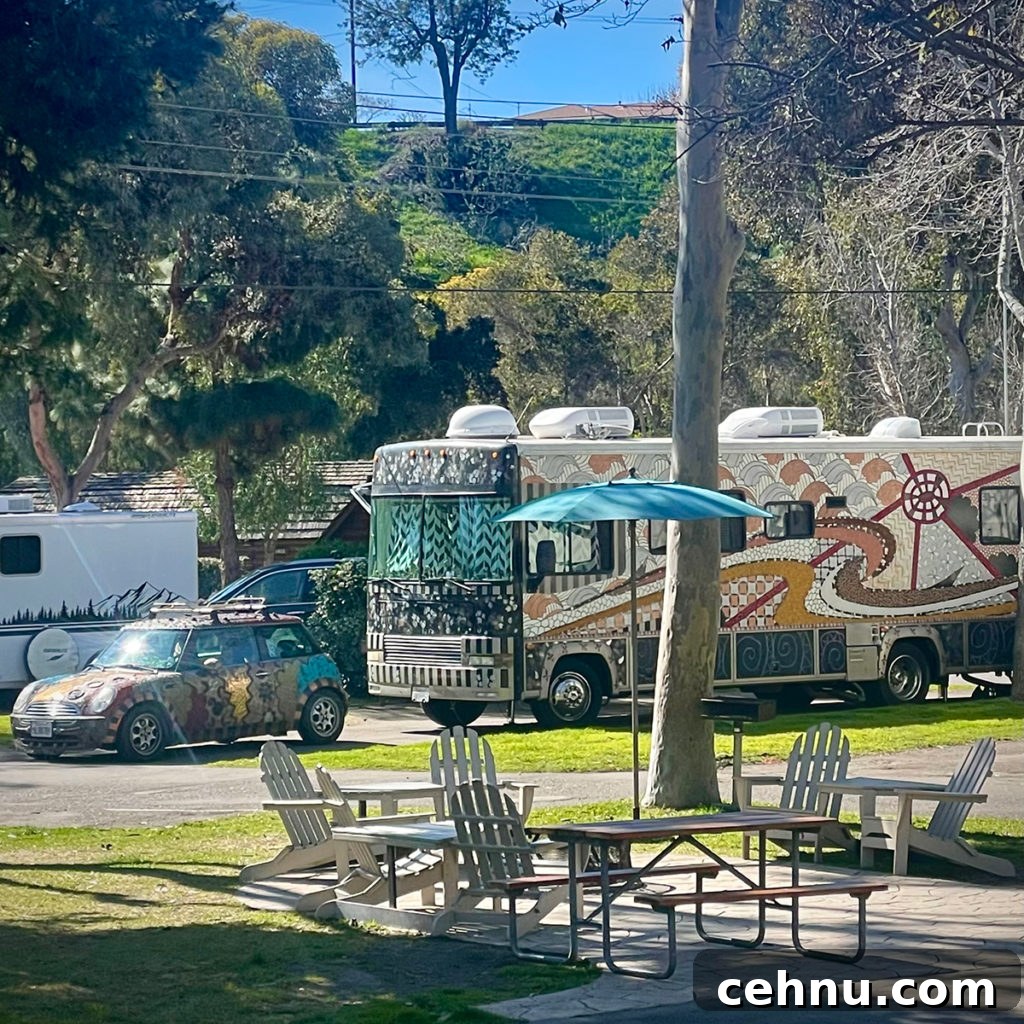 Lets Get Lost February 2022 Travel Inspiration 10 An artistically decorated RV and car parked in a space at the San Diego Metro KOA.