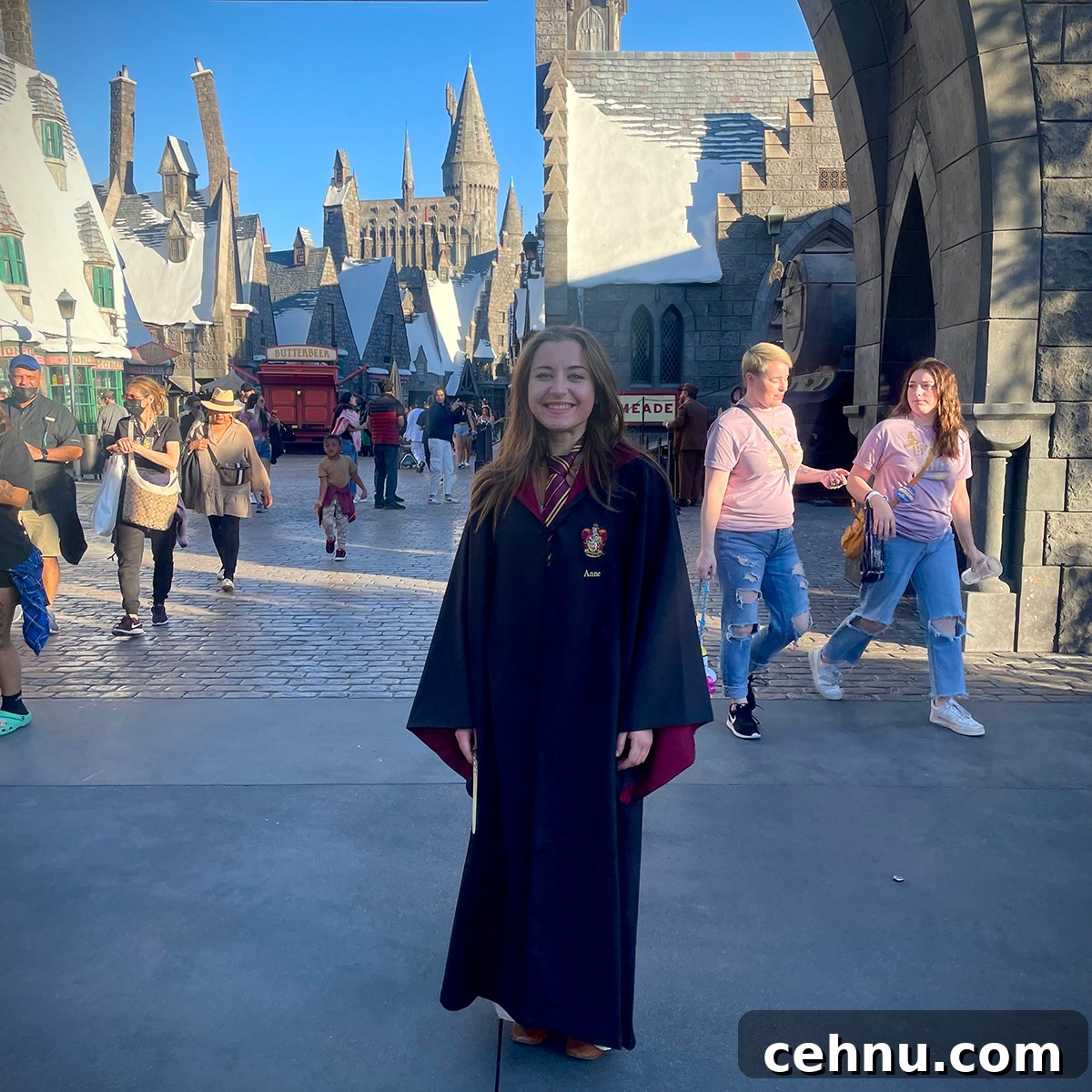 Lets Get Lost February 2022 Travel Inspiration 23 Annie standing in the middle of a street in the Hogwarts exhibit at Universal Studios, California.