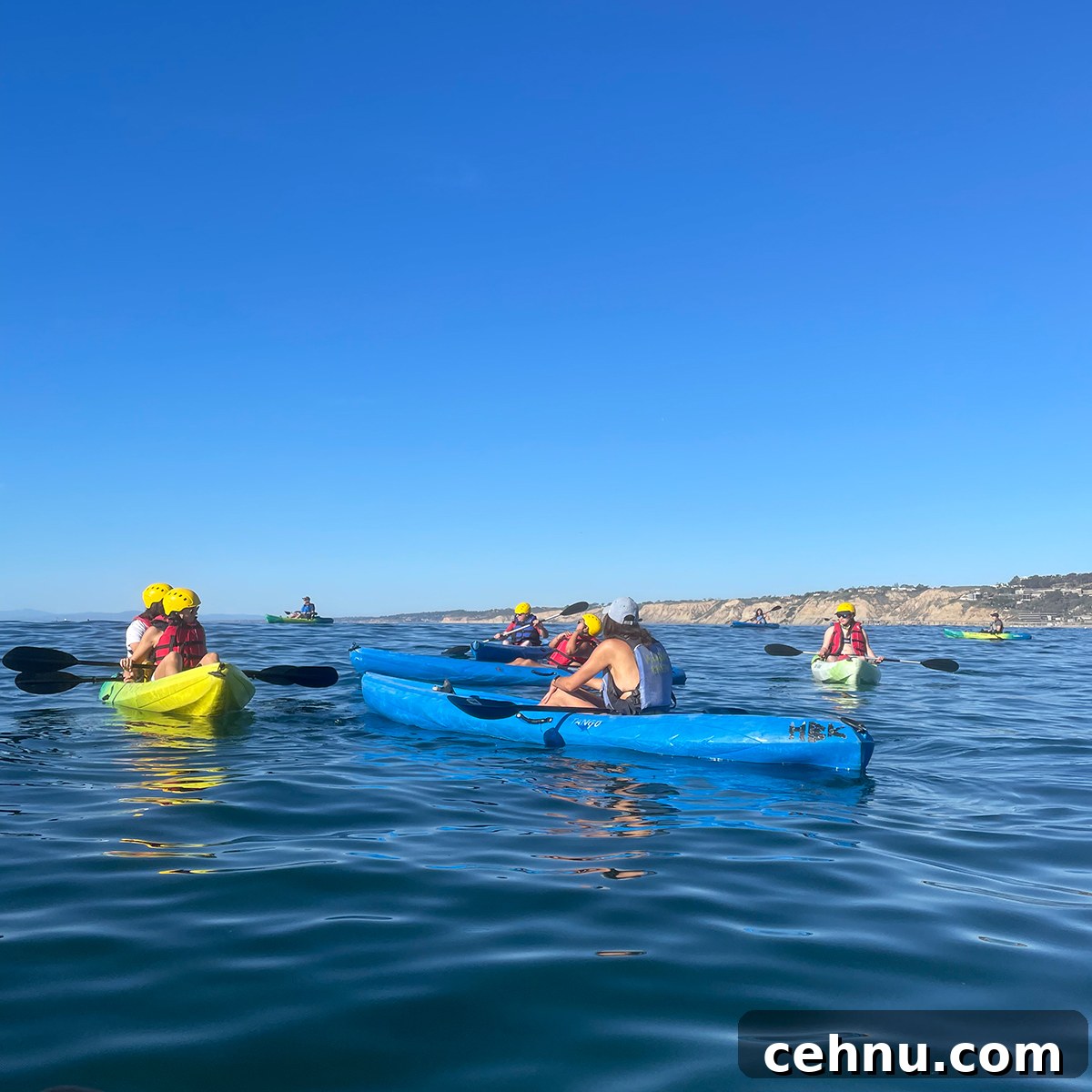 Lets Get Lost February 2022 Travel Inspiration 7 A group of people kayaking in the ocean at La Jolla beach in California.