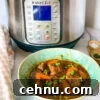 15+ Homemade Soup Recipes for Cozy Weeknight Meals 16 Green bowl with beef stew and an Instant Pot at the back.
