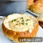 15+ Homemade Soup Recipes for Cozy Weeknight Meals 20 San Francisco Clam Chowder in a bread bowl on a white plate.