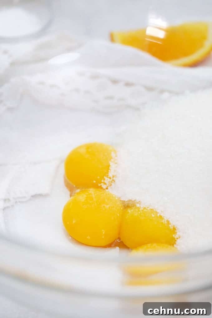 egg yolks and white sugar in a bowl