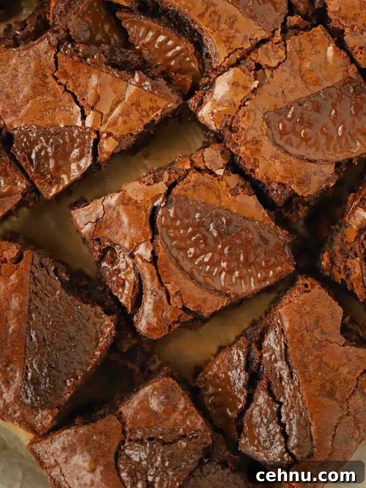 A close up of chocolate orange brownies on a board.