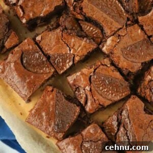 A board with squares of Chocolate Orange Brownie on.