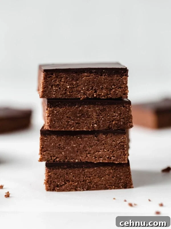 four chocolate protein bars stacked