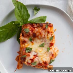 piece of matzo lasagna garnished with fresh basil