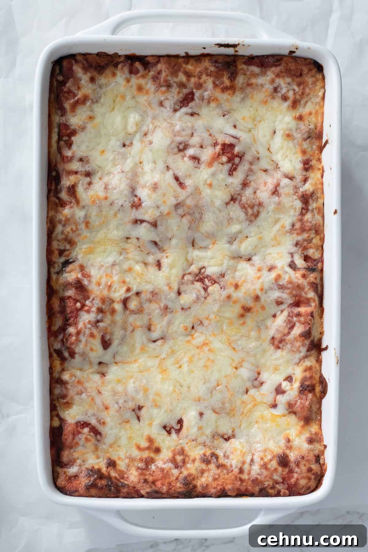 5-Ingredient Matzo Lasagna for Passover Dinner 8 cooked matzo lasagna in a white casserole dish