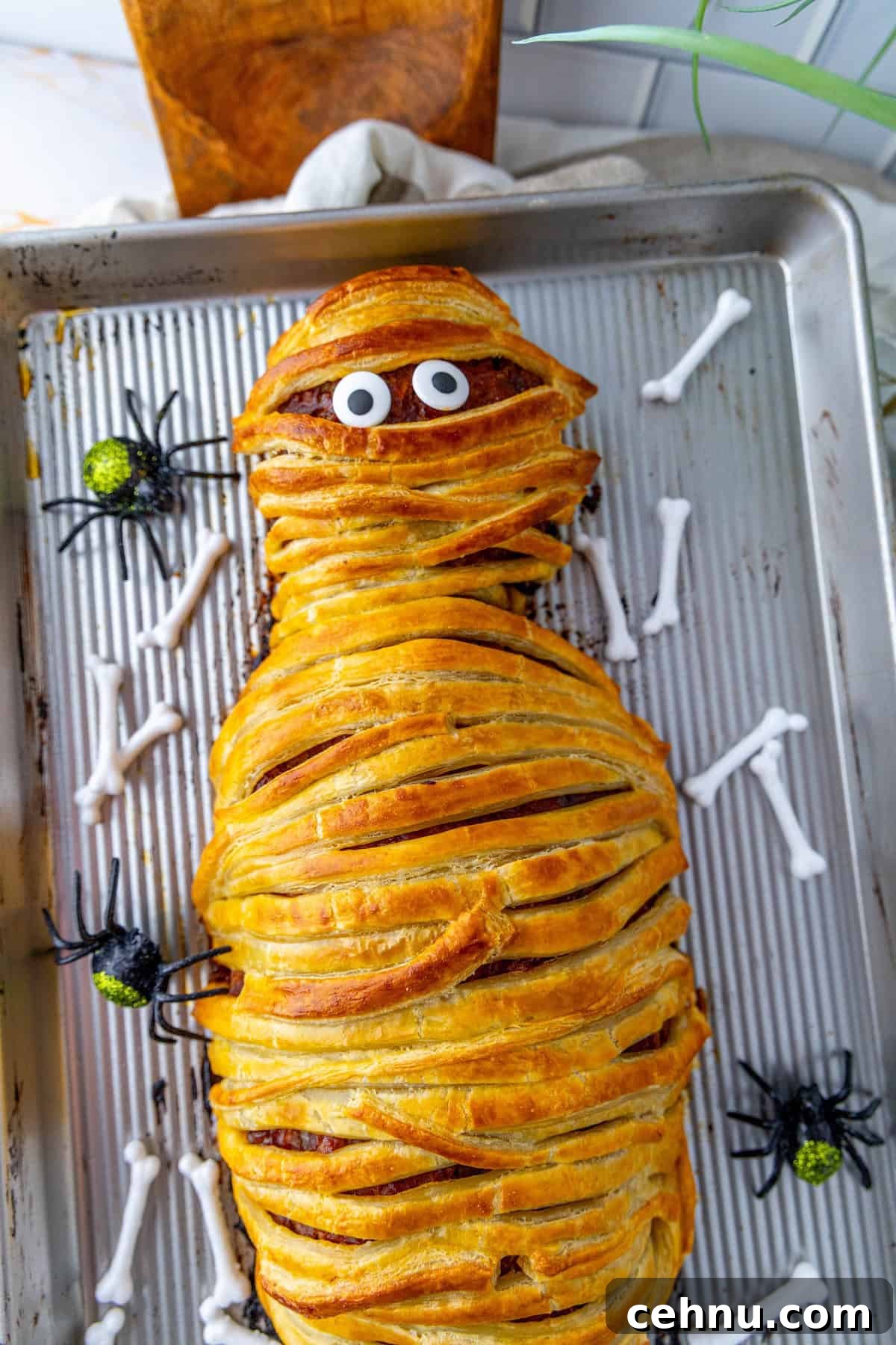 Halloween Mummy Meatloaf Recipe 14 Finished mummy meatloaf with pastry wrapping and edible eyes.