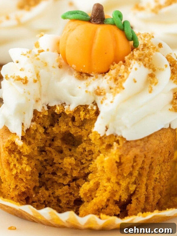 Halloween Mummy Meatloaf Recipe 18 Pumpkin cupcake with cream cheese frosting and a marzipan pumpkin candy on top.
