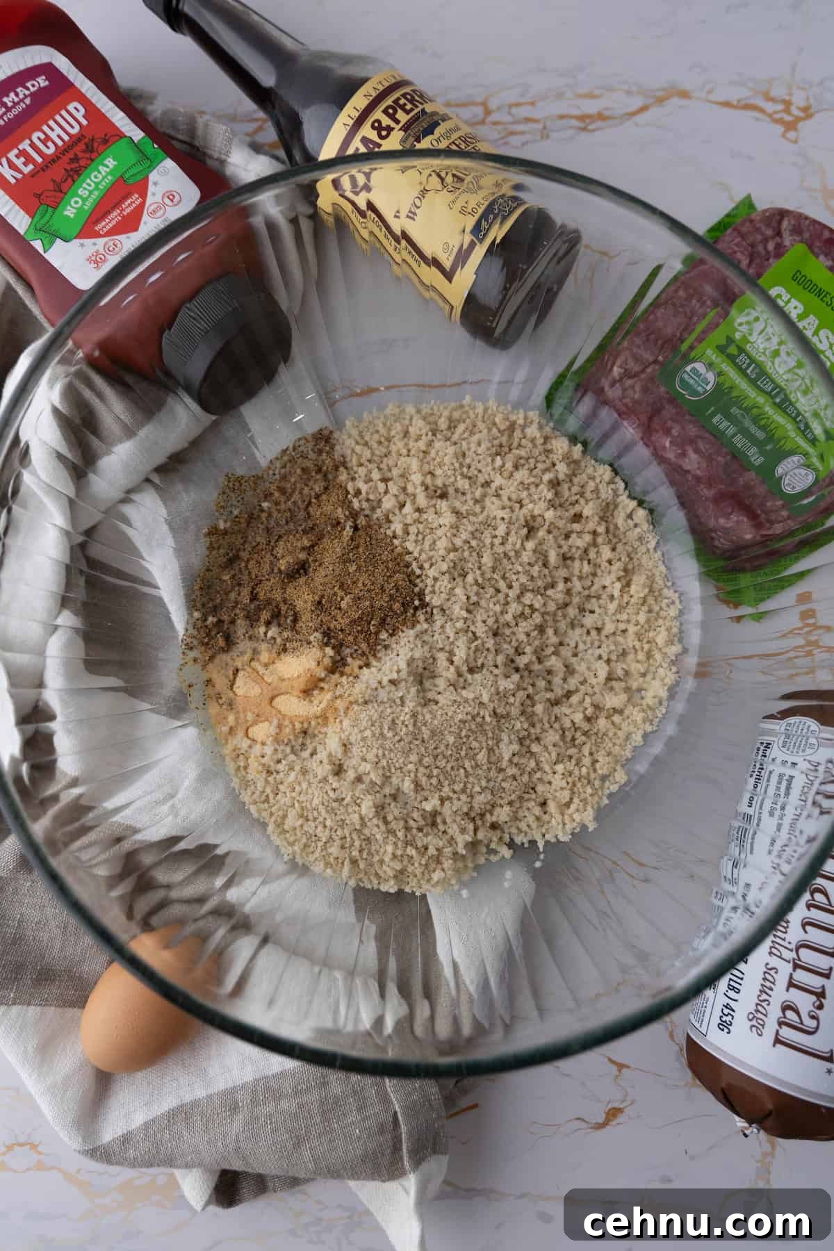 Halloween Mummy Meatloaf Recipe 7 Ingredients for mummy meatloaf arranged on a countertop.