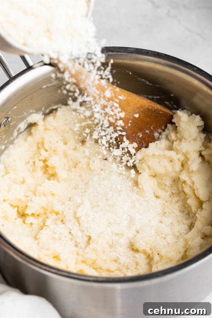 Dehydrated potatoes being poured into a pot of mashed potatoes