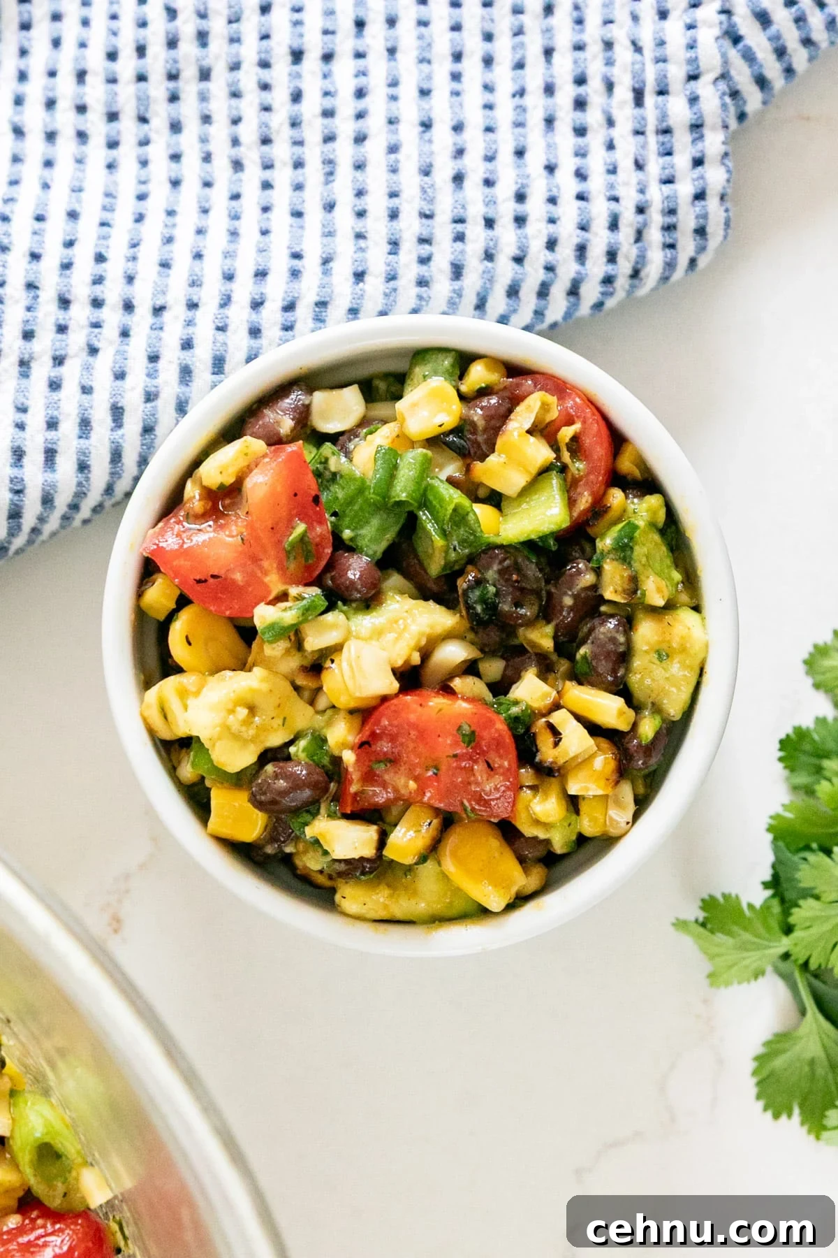 An overhead image of a bowl of corn sand black bean salad.