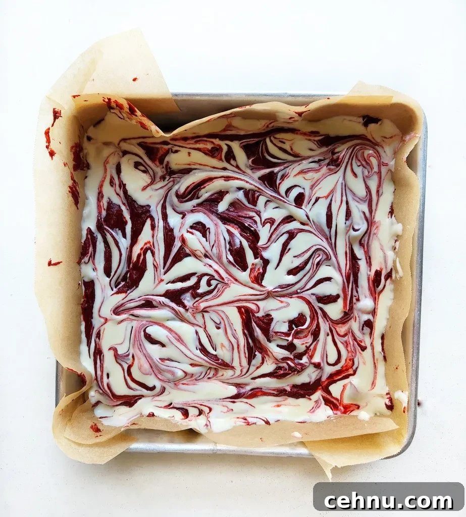 Red Velvet Cheesecake Brownies Recipe with Cream Cheese Swirl 8 swirl the cheesecake and brownie batter together
