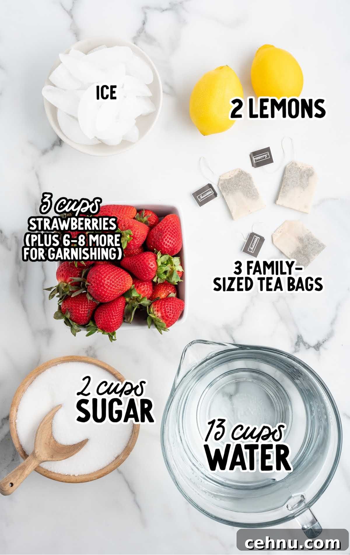 Flat lay of sweet tea ingredients including lemons, strawberries, sugar, tea bags, ice, and a pitcher of water.