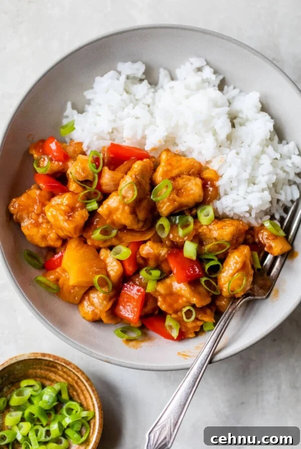 bowl of rice with sweet and sour chicken