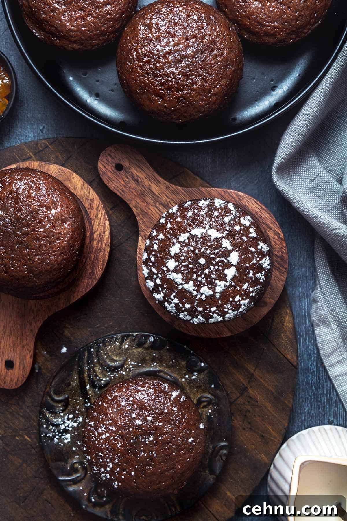 Authentic South African Malva Pudding Cake Recipe 2 Overhead shot of Malva pudding cakes on wooden boards