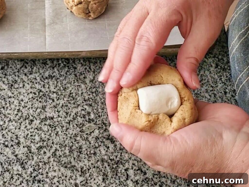 Chewy Gluten Free Smores Cookies Recipe 10 wrapping cookie dough around marshmallow.