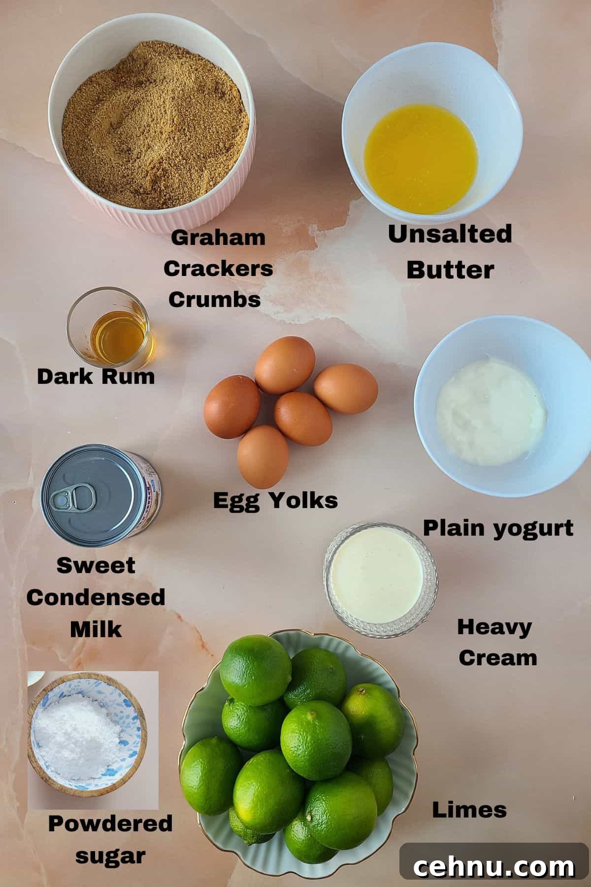 Key lime pie ingredients showcased on beautiful pink marble background