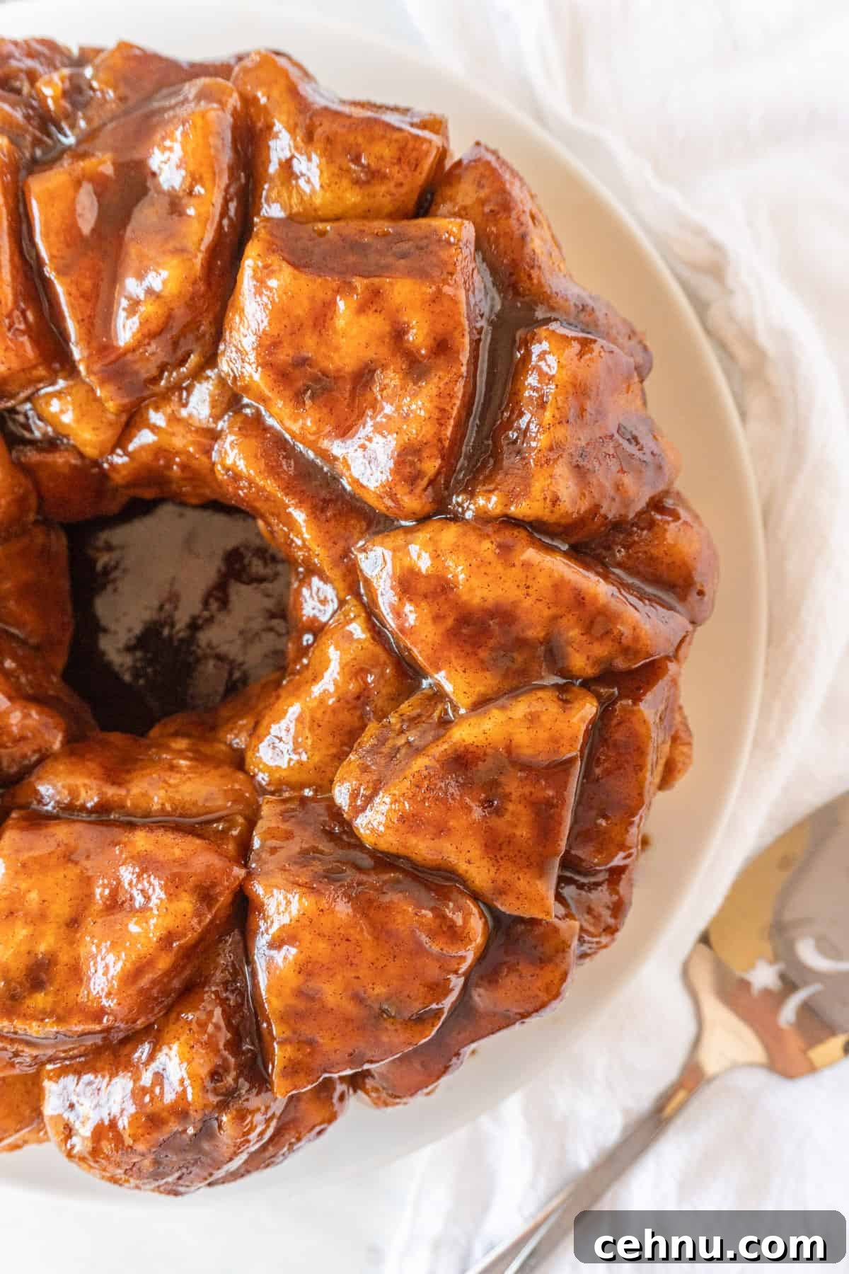 top of cinnamon pull apart bread  on white plate.