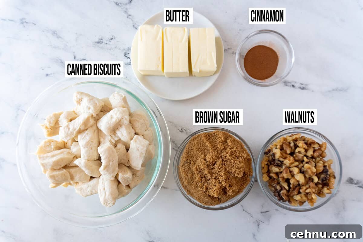 cinnamon pull apart ingredients in individual dishes on marble background.