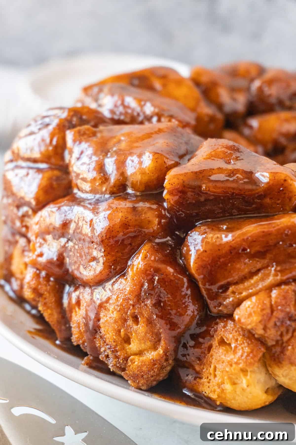 cinnamon pull apart bread  on white plate.