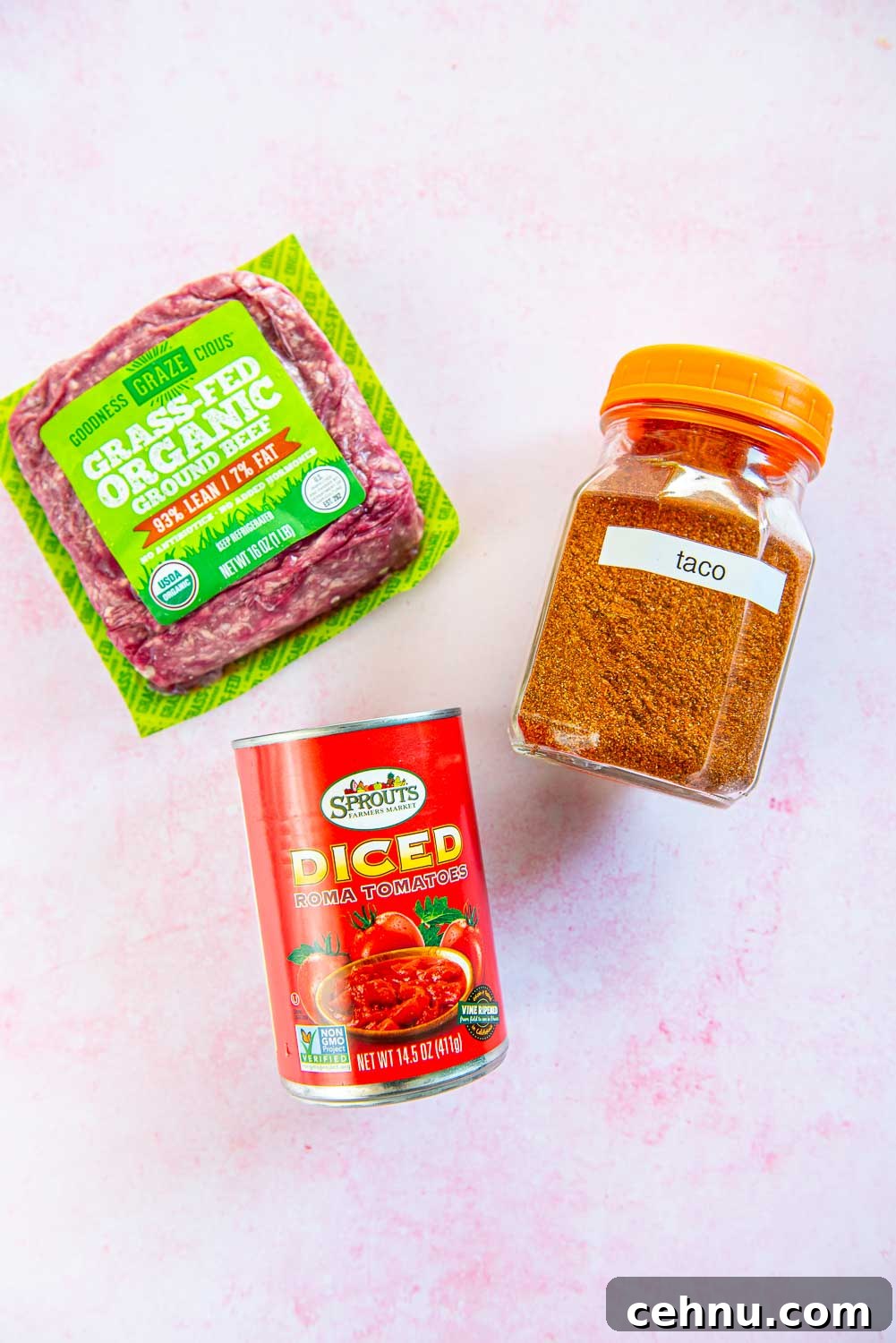 Slow Cooker Taco Meat Recipe: Tender, Flavorful Filling 3 ground beef, taco seasoning, and 14.5 oz can of diced roma tomatoes displayed on pink background
