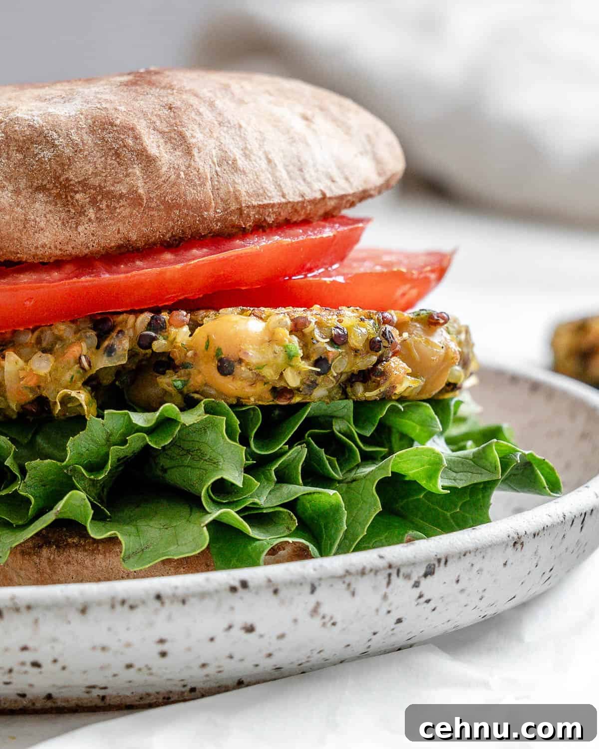 completed Quinoa Chickpea burger plated on a white surface