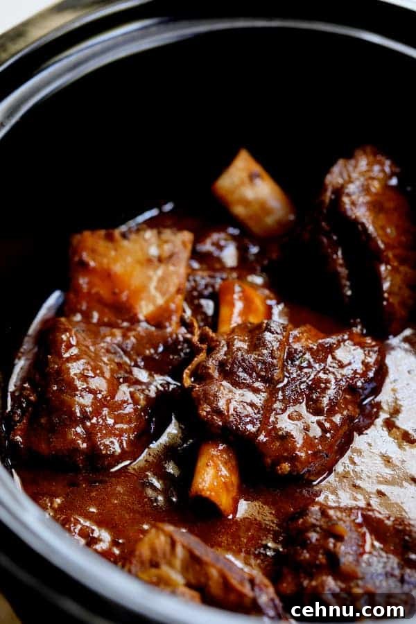 Slow Cooker Barbacoa Short Ribs with Cilantro-Lime Cauli Rice 4 Photo of beef short ribs in a slow cooker.