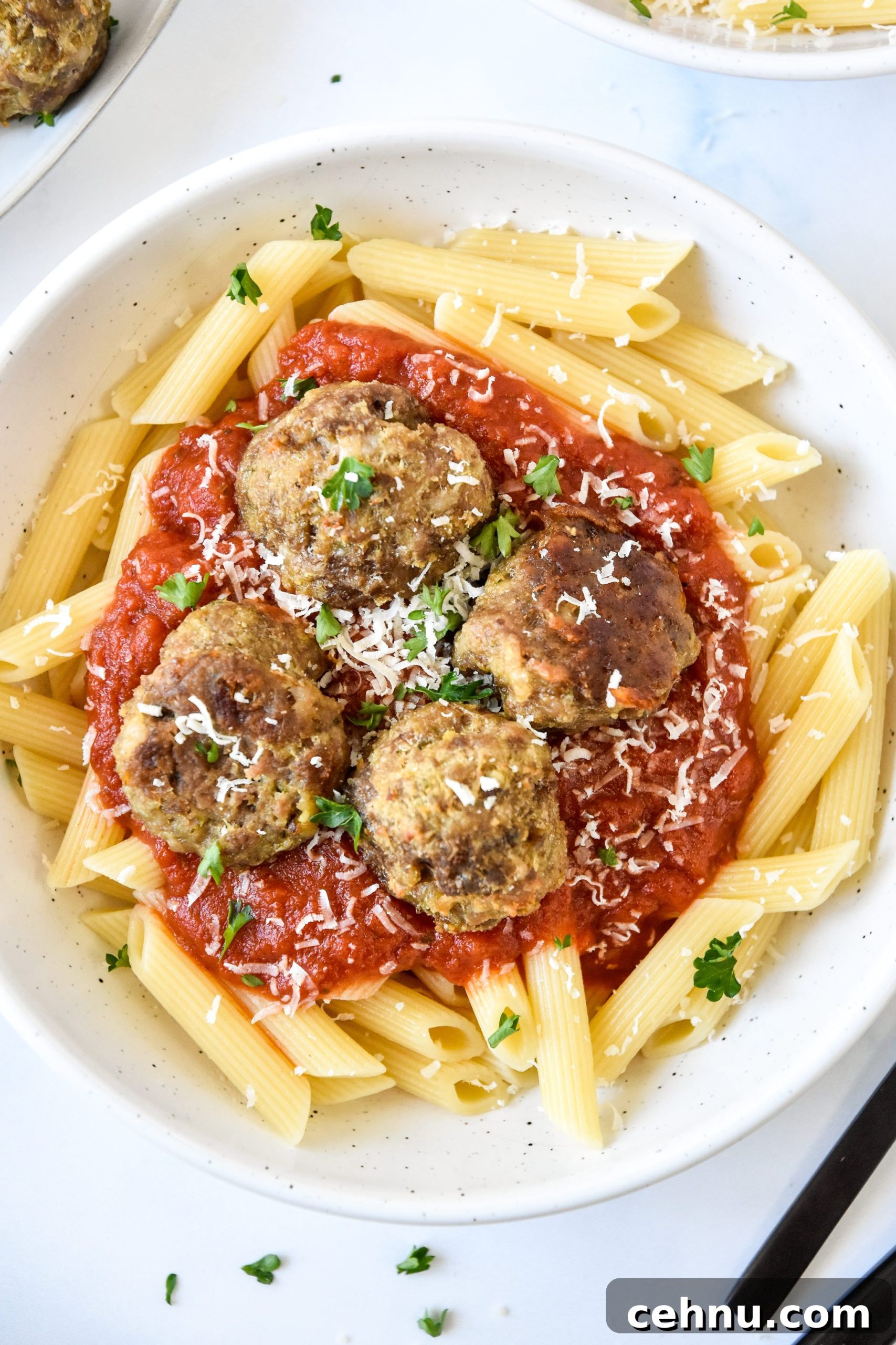 Make-Ahead Freezer Meatballs Recipe for Meal Prep 13 serving meatballs with pasta and red sauce