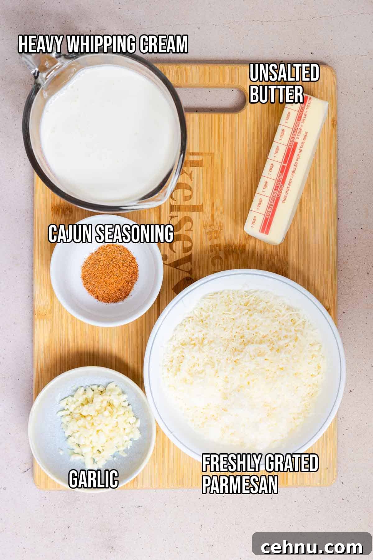 Cajun Alfredo sauce ingredients: butter, garlic, parmesan, and cajun seasoning.