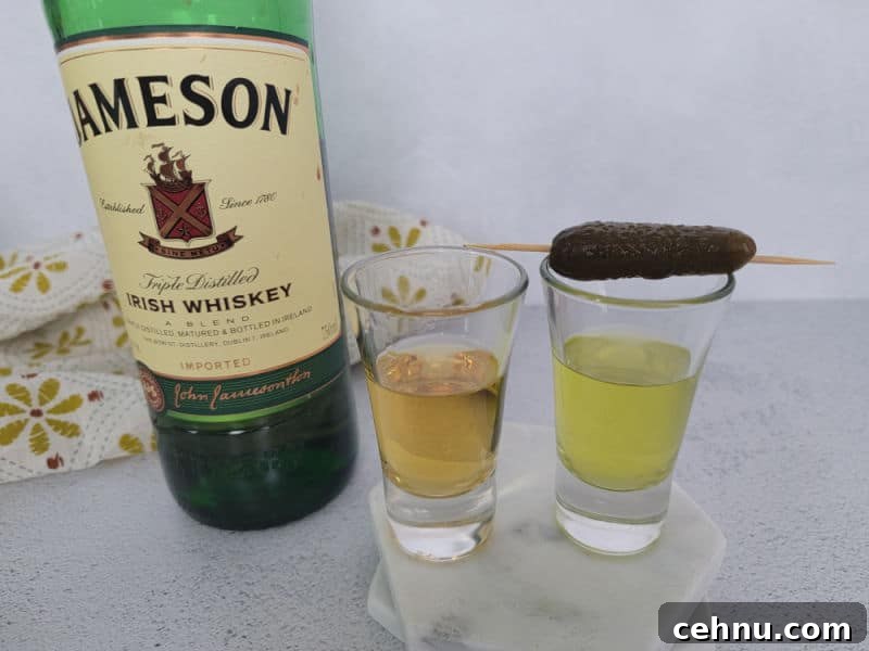 Jameson Pickleback Shot: How to Make It (Video) 4 Jameson Irish Whiskey next to a Pickleback Shot