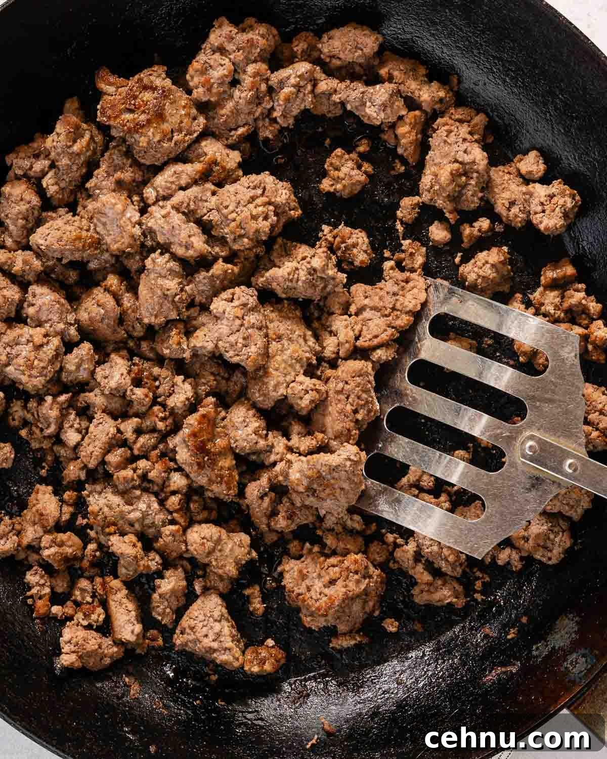 Garlic Bread Sloppy Joes Recipe for Cheesy Saucy Sandwiches 5 cooked ground beef in a skillet.