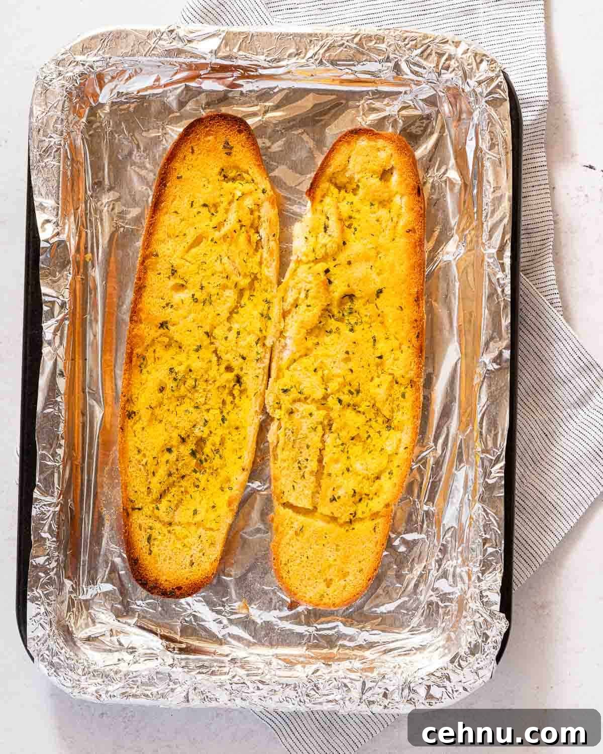 Garlic Bread Sloppy Joes Recipe for Cheesy Saucy Sandwiches 7 cooked garlic bread on baking tray.