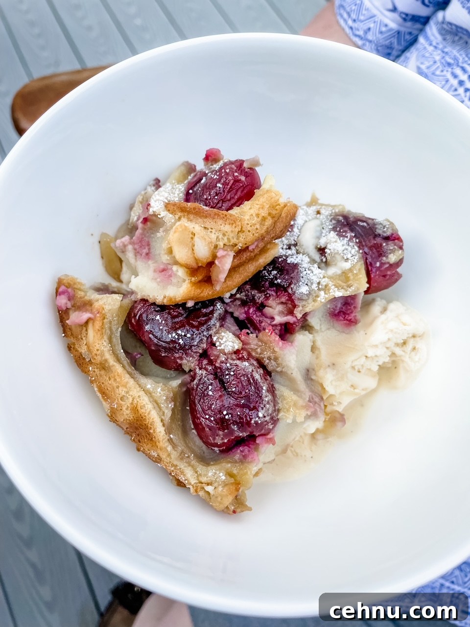 How to Make Fresh Cherry Clafoutis 6 A slice of the Fresh Cherry Clafoutis in a white bowl