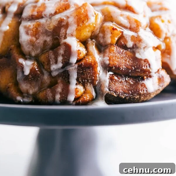 The finished cinnamon roll monkey bread recipe with the cream cheese frosting, showcasing the texture and flavor of this delightful dessert.
