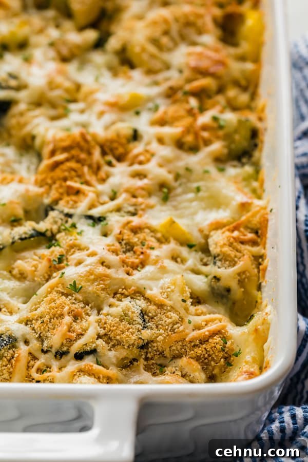 Cheesy Yellow Squash Casserole Recipe 6 A side angle shot of the corner of the pan of zucchini casserole
