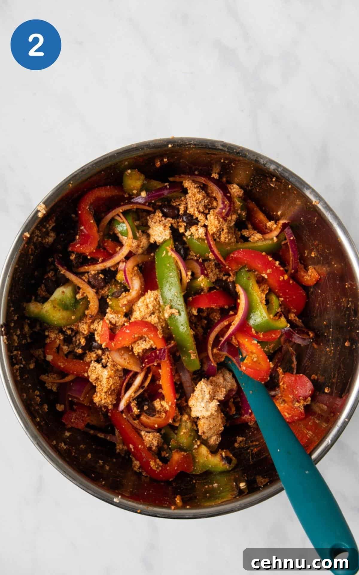 Spices, Red Pepper, Tamari, Olive oil, red onion, and green pepper combined together in a mixing bowl.