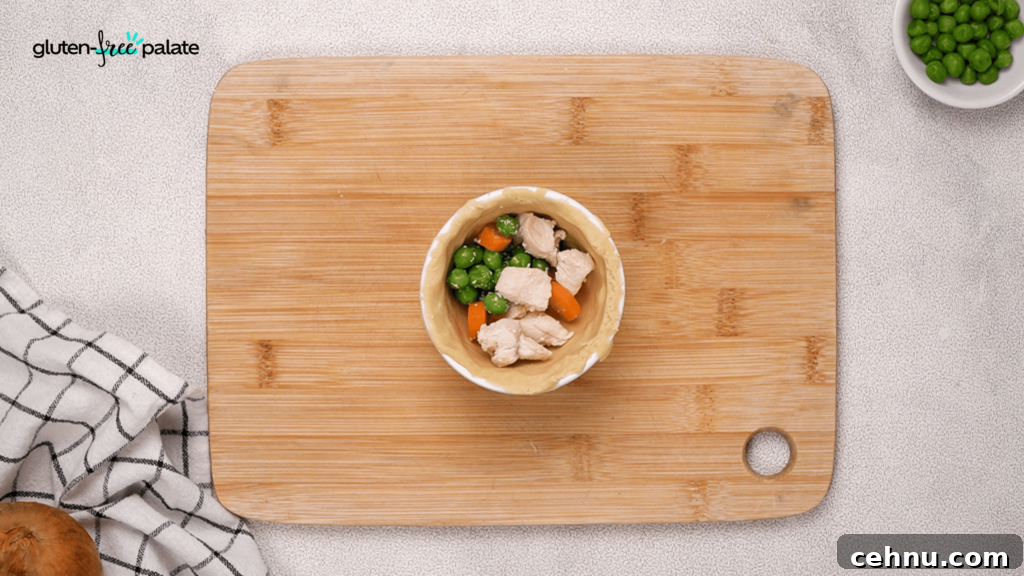 Gluten Free Chicken Pot Pie Recipe with Flaky Crust 13 Add your filling to the chicken pot pies. Next, you'll add the gravy.