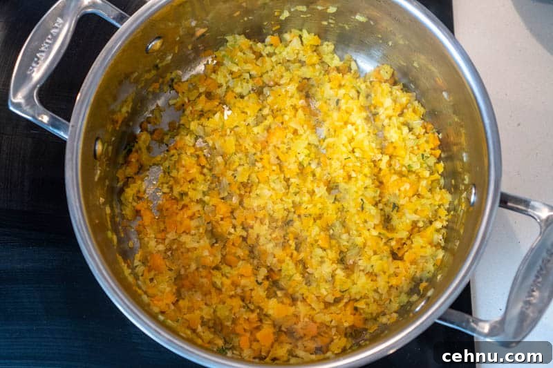 Cooking the carrot, onion, celery, cilantro stems & ginger