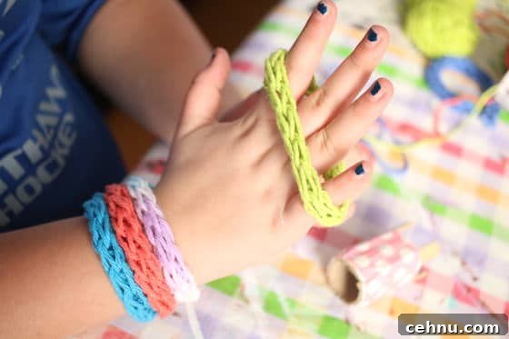 More Than 30 Toilet Paper Roll Crafts and Activities for Kids 17 child modeling french knitted bracelets