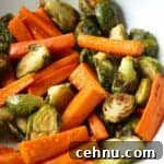 Roasted Brussels Sprouts and carrots with honey butter in serving dish.