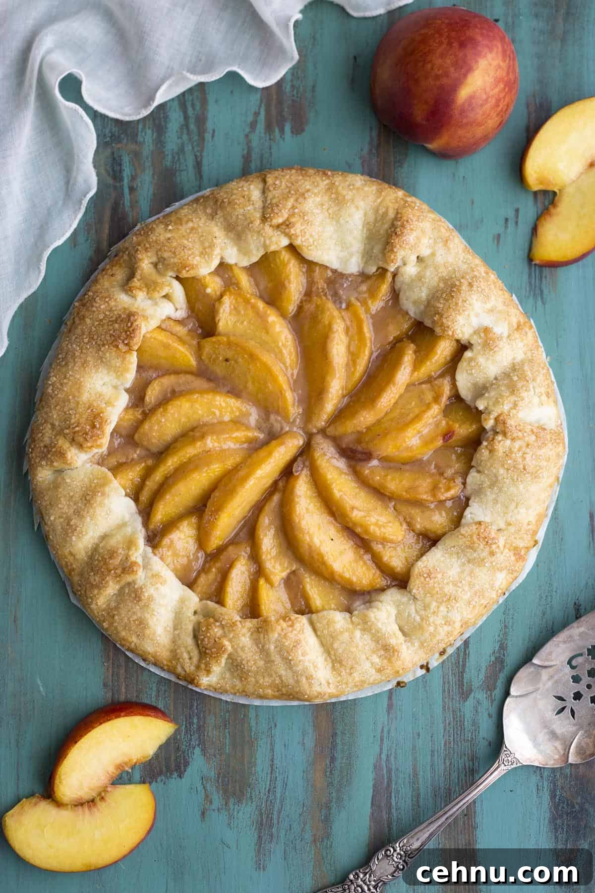 Rustic Peach Crostata or Galette Recipe 8 A peach crostata on a green table top.